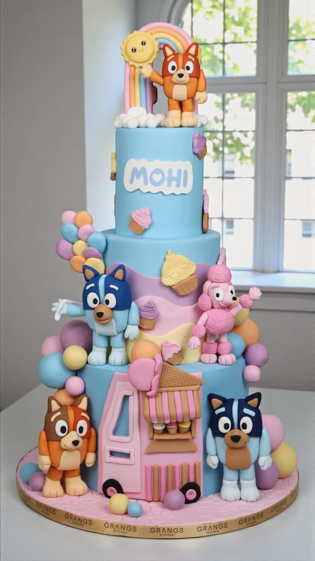 Colourful character-themed birthday cake with playful details