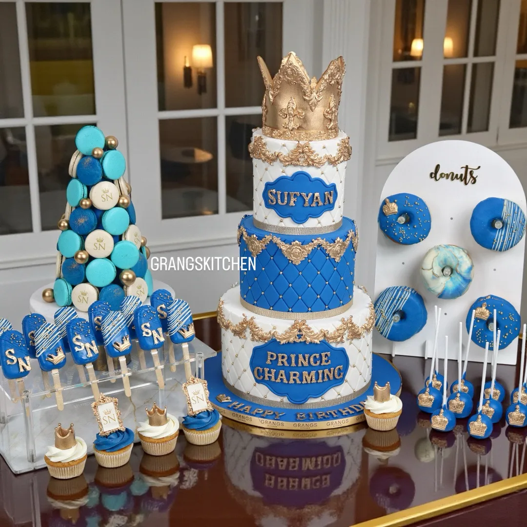 Blue and gold birthday cake and dessert setup for Sufyan