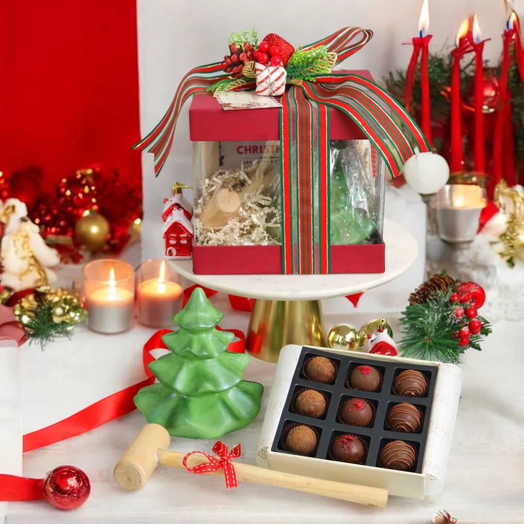 Christmas festive gift box with chocolates and seasonal decor