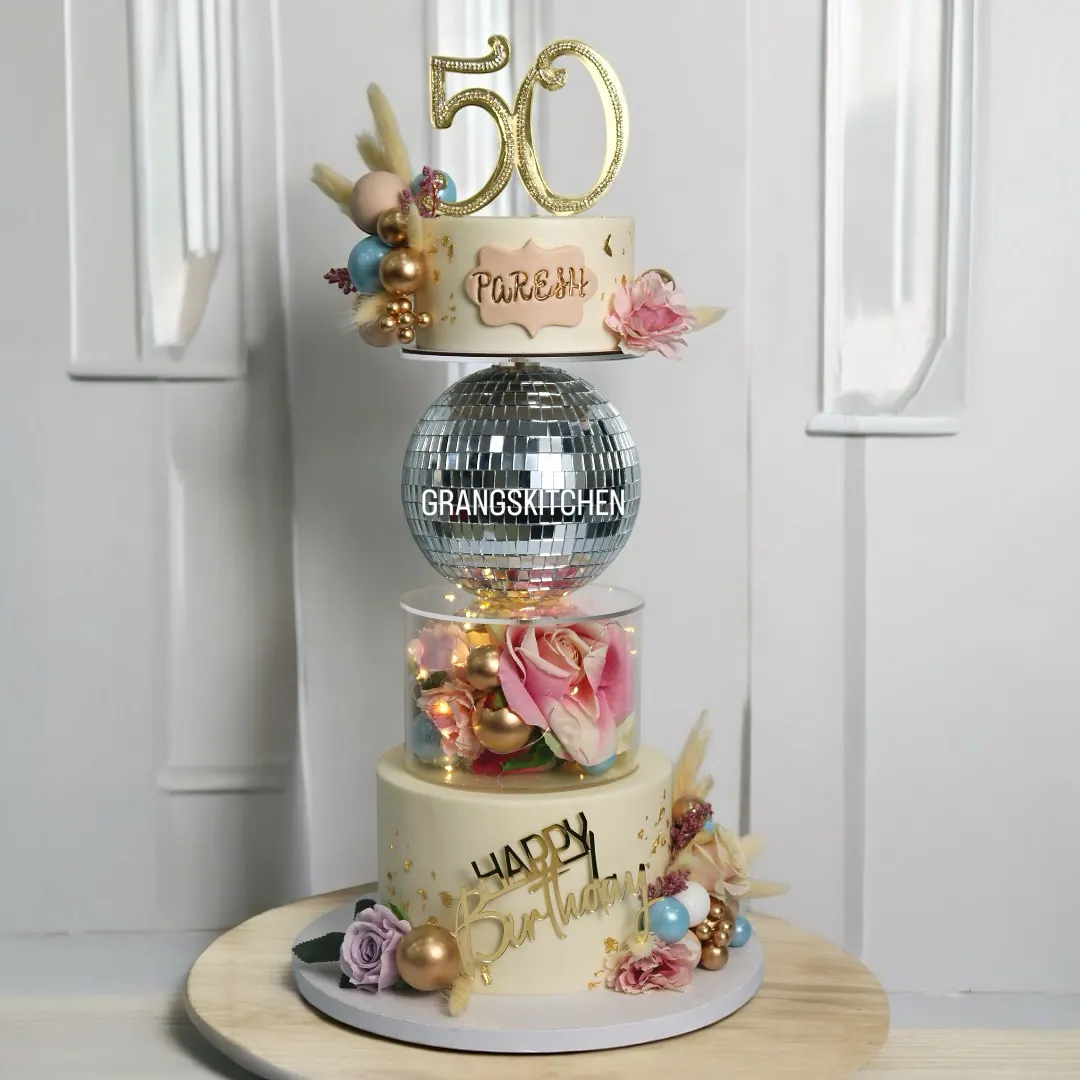 Fiftieth birthday cake with disco ball and pastel details