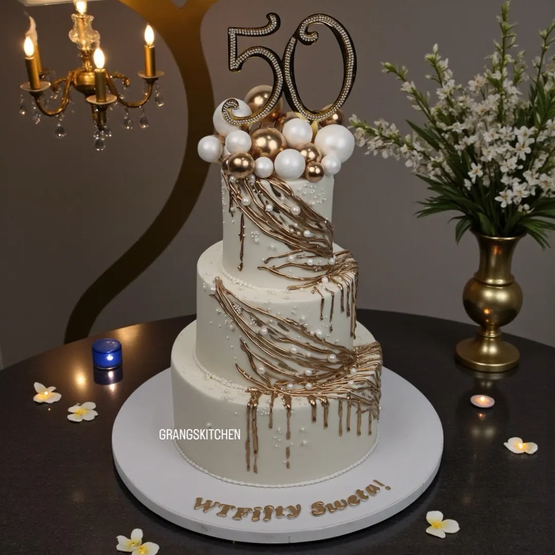 White and gold cake created for a 50th birthday
