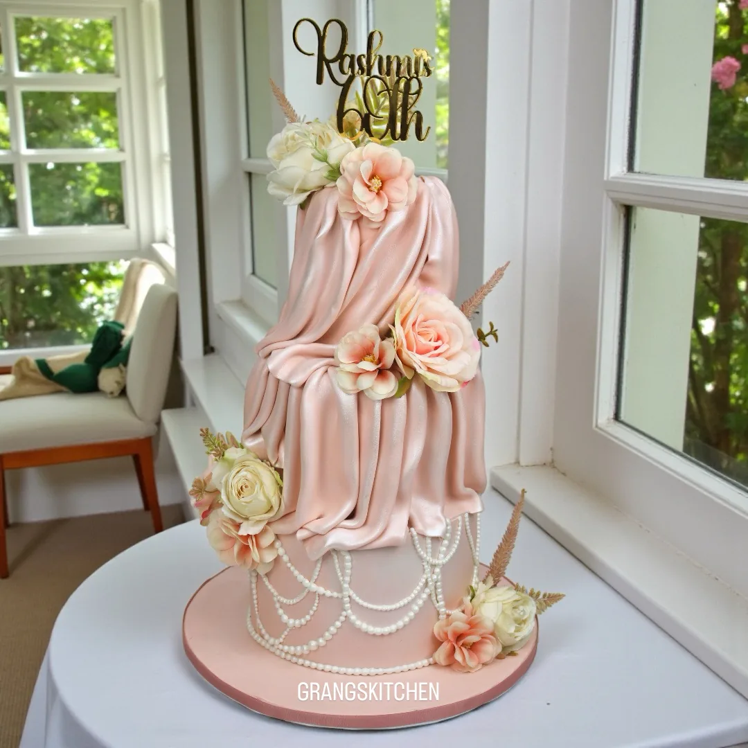 Elegant pink floral cake created for a 60th birthday celebration
