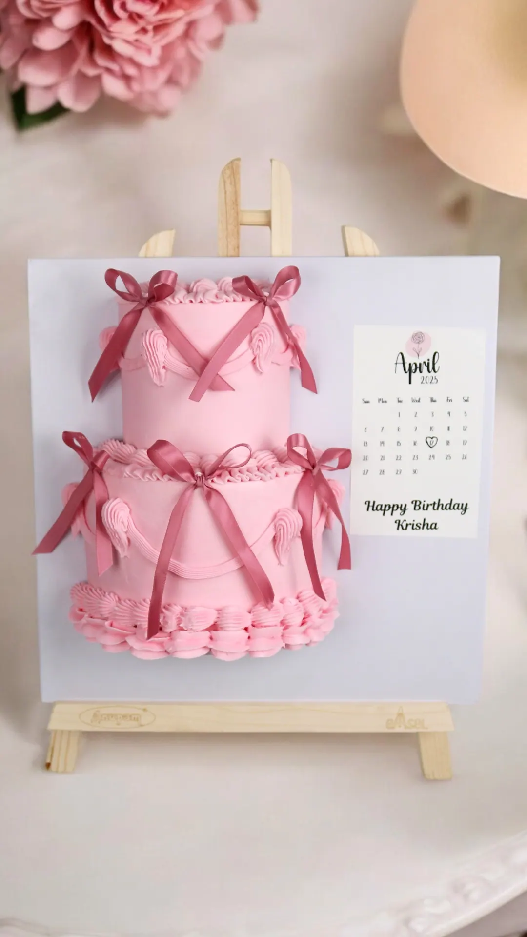 Pink gift-shaped cake for a birthday celebration