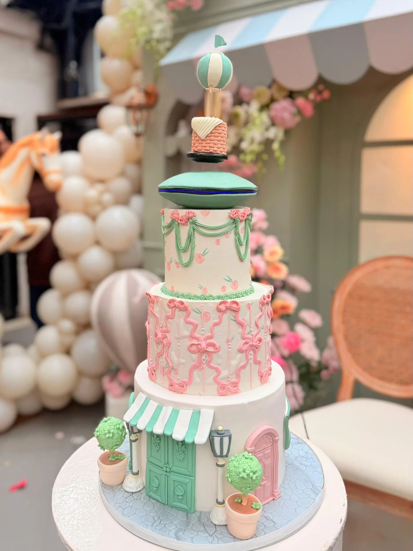 Pastel multi-tier levitating cake with floating decorative elements