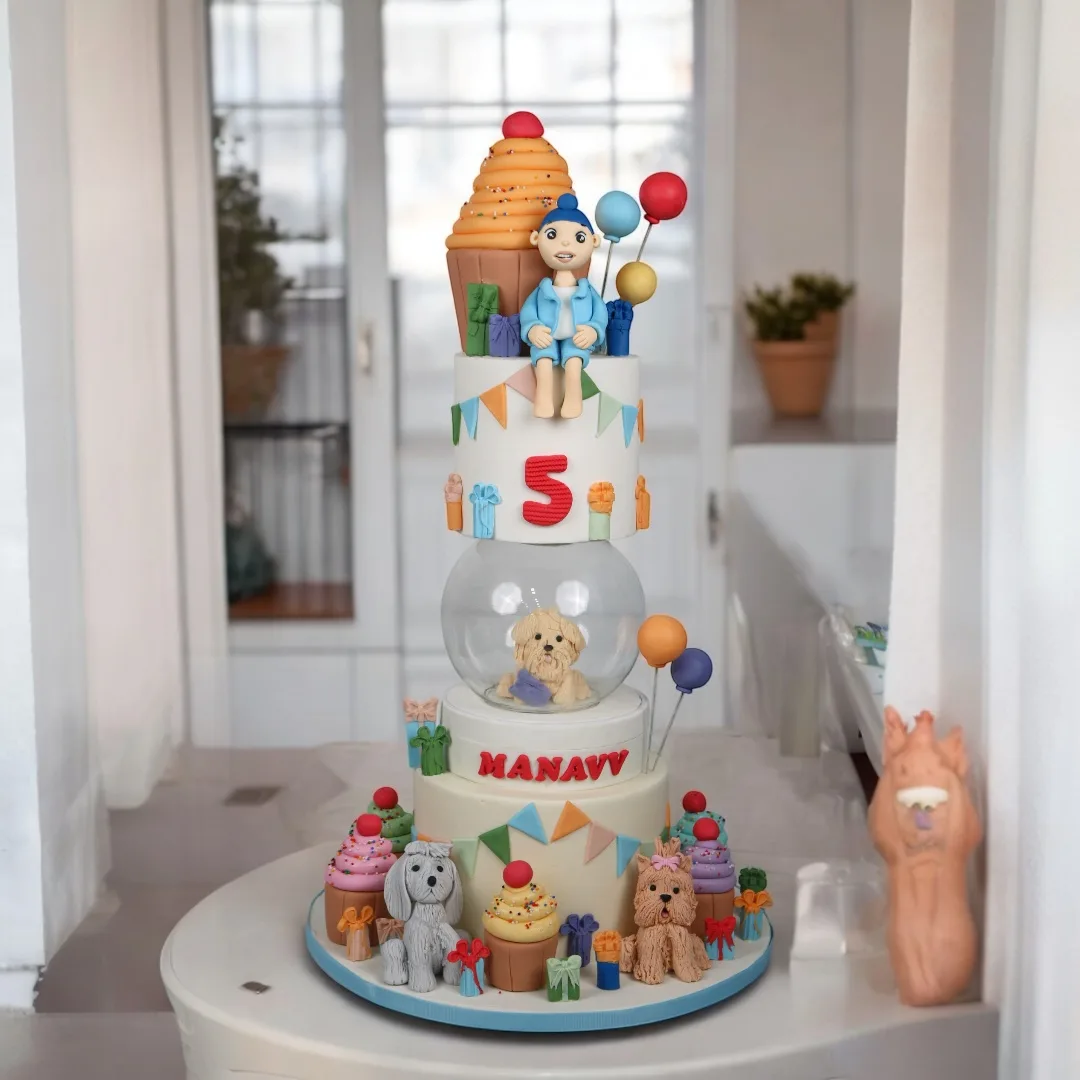 Candy shop birthday cake with sweets, balloons and playful details