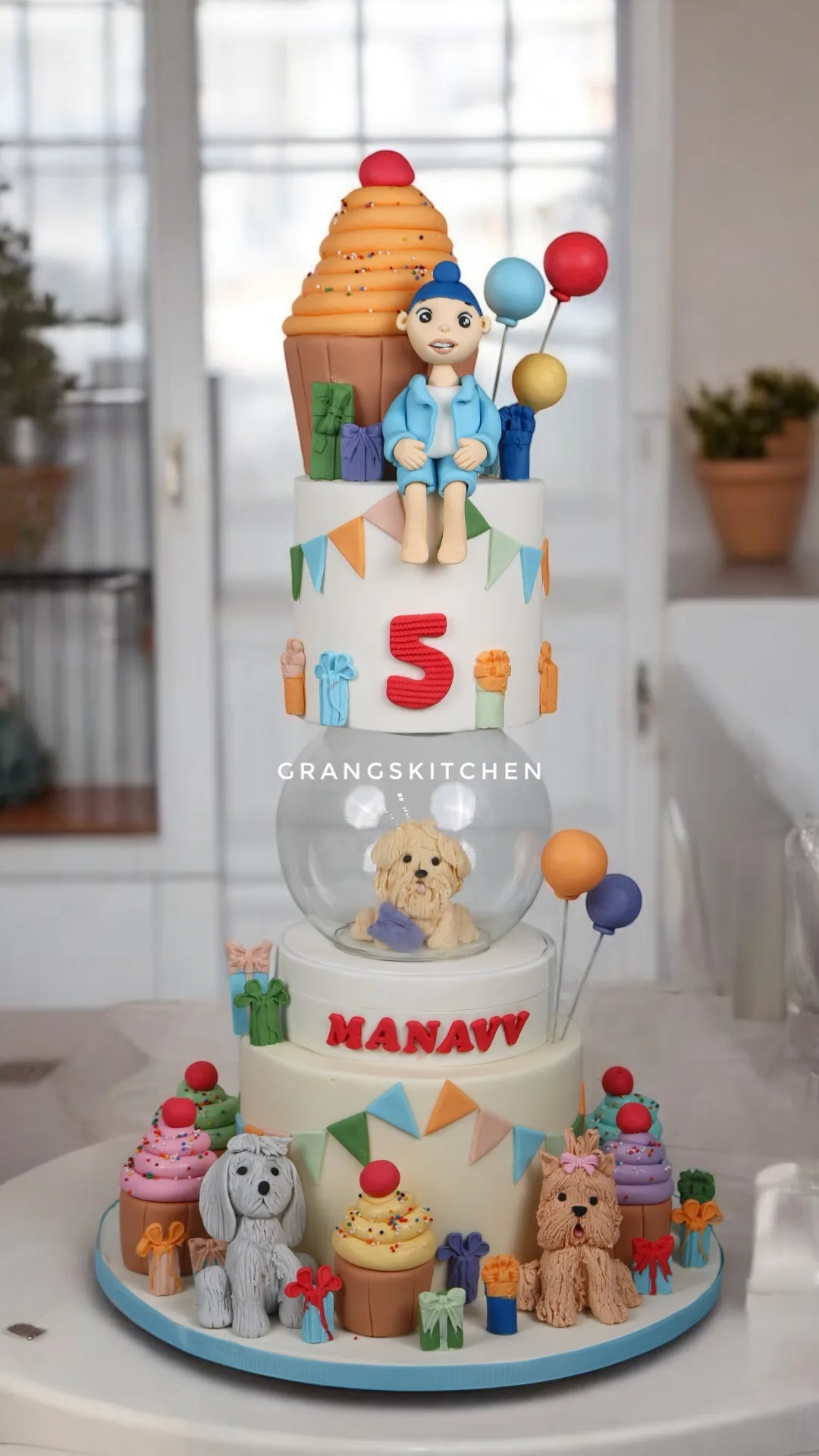 Candy theme birthday cake with ice cream, balloons and sweets