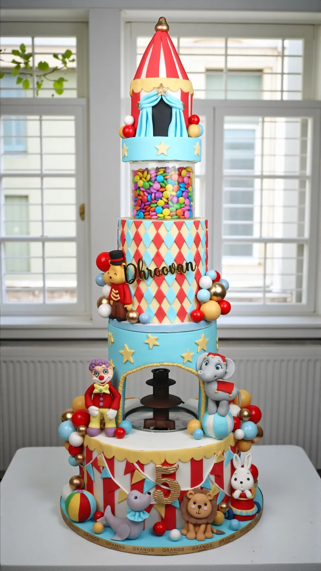 Colourful carnival-themed birthday cake with circus decorations