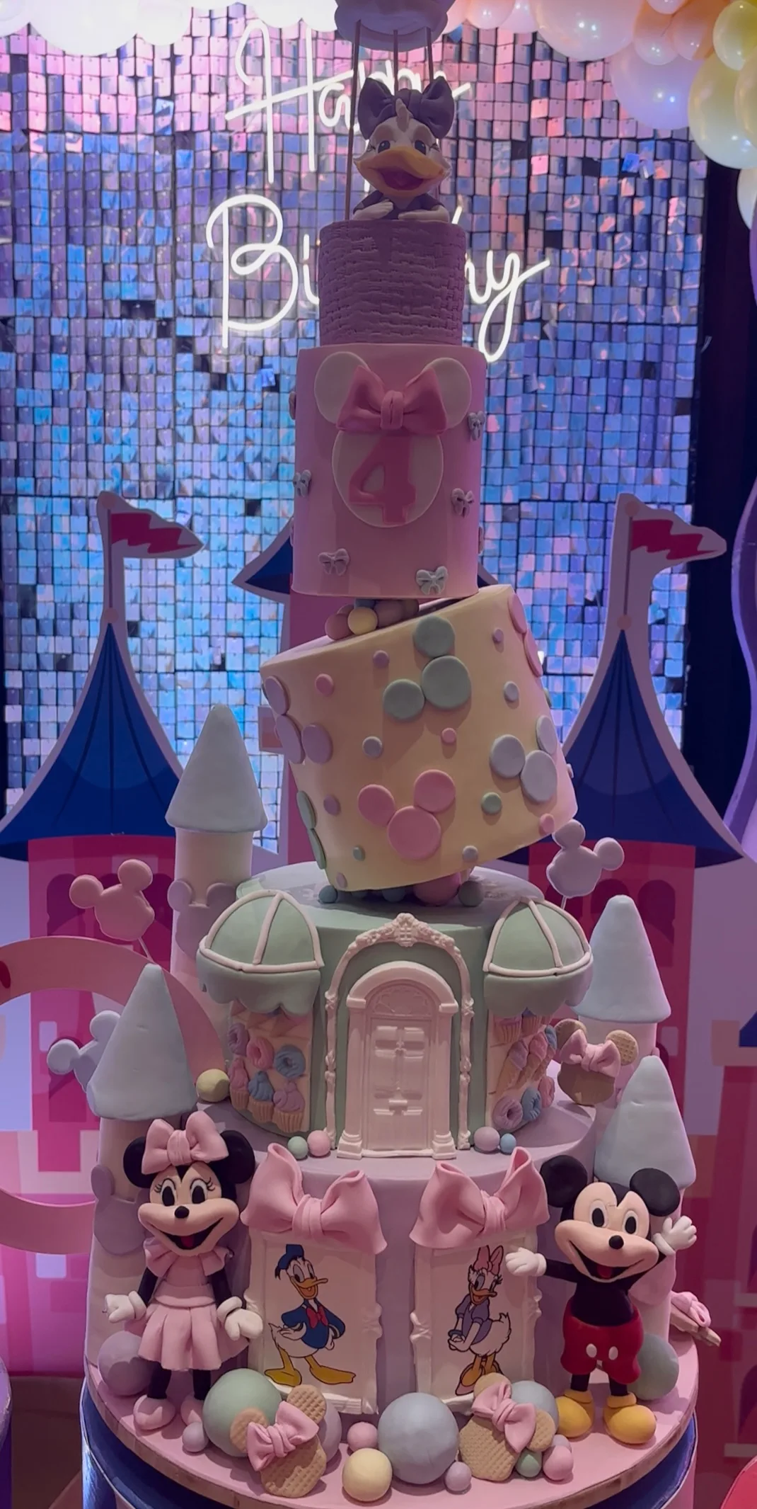 Castle character birthday cake with pink party backdrop