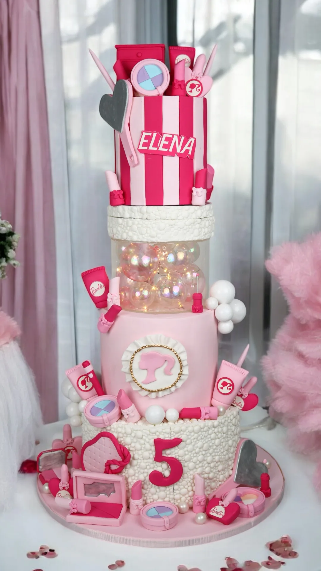 Pink craft-themed birthday cake with stationery and handmade details