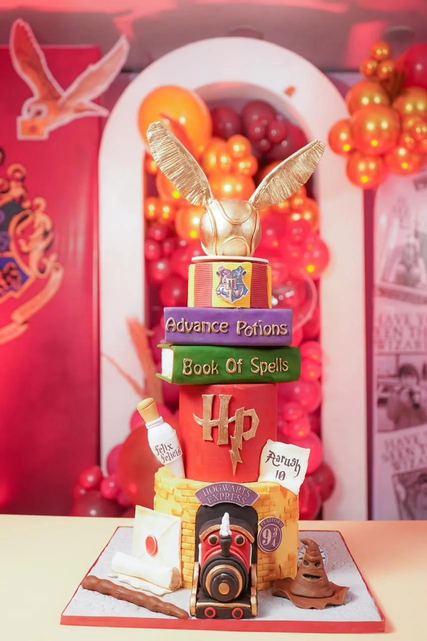 Harry Potter-themed birthday cake with potion, train and magical details
