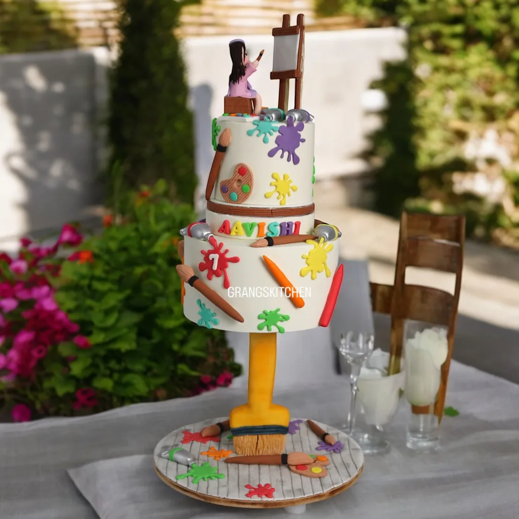 Painting theme kids cake with easel and colourful art details