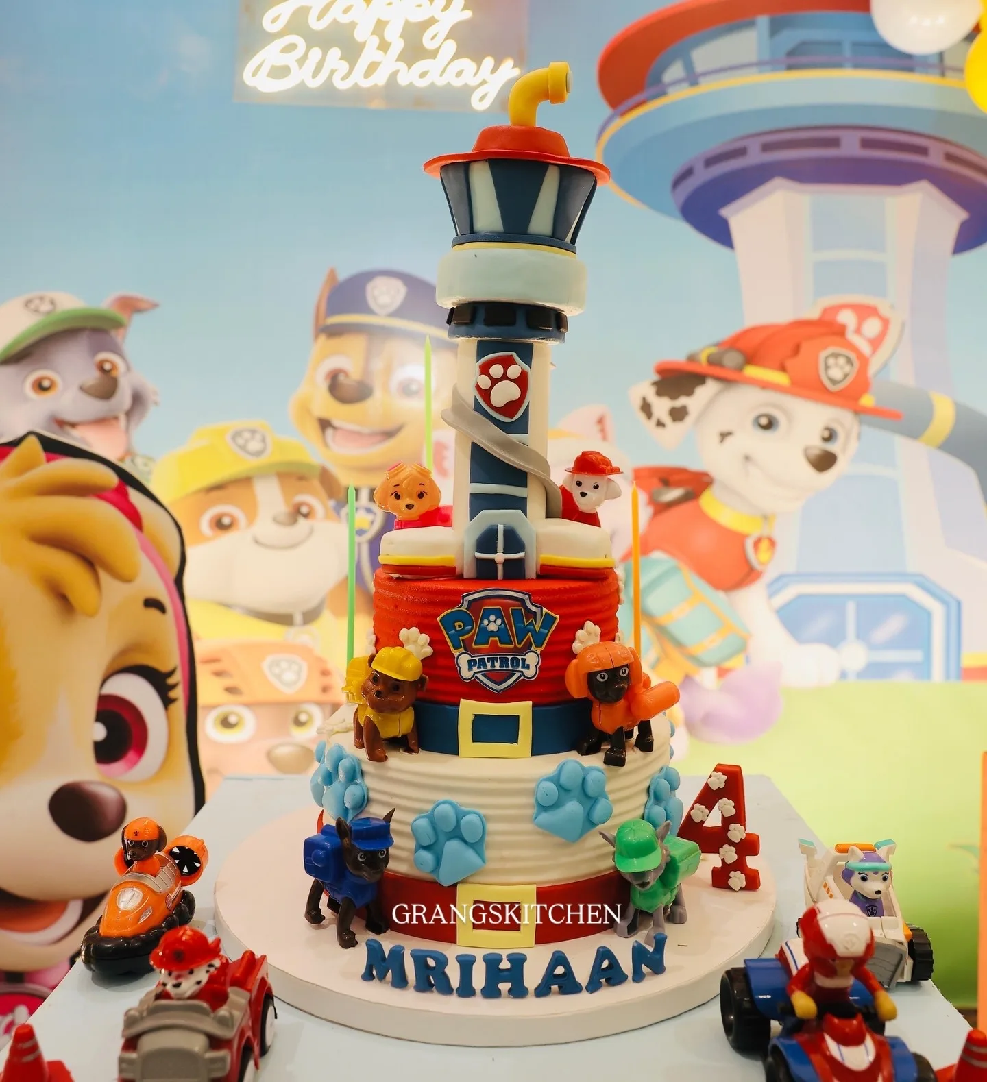 Paw Patrol-themed cake with lookout tower and character figures