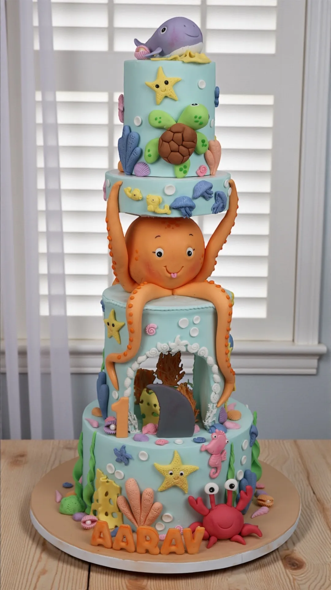 Tall sea world birthday cake with sea animals and ocean details