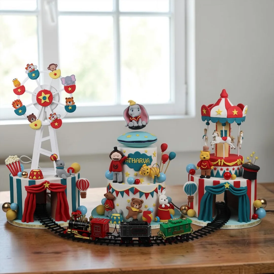 Carnival theme cake setup with train track and circus details