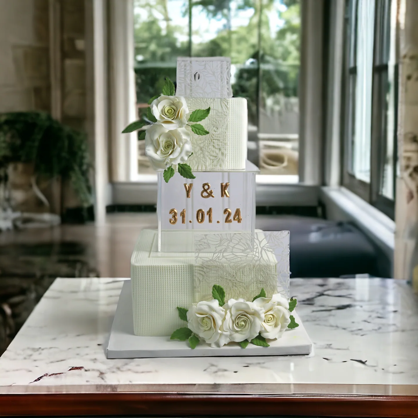 Modern white wedding cake with roses and geometric tiers